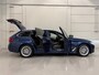 BMW 5-Serie Touring 530e xDrive High Exe PANO/TREKHAAK/H&K/HEAD-UP/ADAPTIVE-ONDERSTEL/18"/360CAMERA/LEER-COMFORT/MASSAGE+MEMORY/ACC/SFEER/LED/LUCHTVERING/PHYTONICBLAU/BMW DEALER HISTORIE