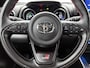 Toyota Yaris 1.5 Hybrid GR Sport | JBL | Head-up Display | Dodehoek detectie | Stoel+Stuurverwarming | Parkeersensoren voor+achter | Draadloze telefoonlader | Apple CarPlay/Android Auto | Cruise Control Adaptive |