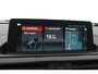 BMW 1-Serie 118i Executive Automaat (GROOT-NAVIGATIE, LED, PANORAMADAK, CAMERA, SPORTSTOELEN, GROOTLICHT ASSIST, PDC)