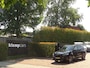 BMW X1 sDrive20i Sportif | All-Black | Uniek | Custom | 19 inch | Nav
