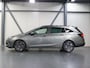 Opel Astra ST 105PK 120 Jaar Edition | 1ste eigenaar | Camera | Trekhaak | AppleCarPlay/Android | Armsteun | AGR stoelen | Navigatie | Climate Control | Cruise Control | Isofix | Privacy Glass | Parkeersensoren |
