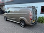 Ford Transit Custom GB 2.0 TDCi 170PK 320 L2H1 Limited/ 18 Inch/ RVS Imperiaal/ Sidebars/ Vloer + wand platen/ Stoelverwarming/ Trekhaak/ Apple Carplay/ Zeer nette bus