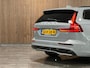 Volvo V60 T6 AWD Recharge Ultra Dark | Trekhaak | Schuifdak | Head-Up Display | Harman Kardon | Adaptieve Cruise Control | Stoelverwarming voor+achter | Stuurwielverwarming | Full LED Meesturende koplampen | Parkeercamera | Pilot Assist | BLIS Dode Hoek Detectie | Elektrische voorstoelen geheugen | Lederen bekleding | Zitting verlenging voorstoelen | Lederen dashboard | Google Infotainment | Keyless Drive | Parkeersensoren voor+achter | Privacy Glass | Elektrisch bedienbare achterklep | DAB Radio | Apple Carplay/Android Auto | Volvo On Call met mobiele App functie | Vapour Grey Metallic |