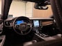 Volvo V90 T8 AWD Plus Dark Long Range | Schuifdak | Harman Kardon | 455pk | Adaptieve Cruise Control | Stoelverwarming voor+achter | Stuurwielverwarming | 19 Inch | Full LED Meesturende koplampen | Pilot Assist | BLIS Dode Hoek Detectie | Elektrische voorstoelen geheugen | R-Design Contourstoelen Nappa Leder met wit stiksel en bies | Zitting verlenging voorstoelen | Lederen Dashboard | Keyless Drive | Parkeersensoren voor+achter | Privacy Glass | Elektrisch bedienbare achterklep | Geïntegreerde zongordijnen achterportieren | Verlichte instaplijsten | DAB Radio | Apple Carplay/Android Auto | Volvo On Call met mobiele App functie | Denim Blue Black Metallic |