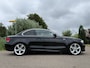BMW 1-Serie Coupé 135i High Executive | Origineel NL | Handgeschakeld | 18" Velgen | Stoelverwarming | Clima | Navi | PDC | Cruise