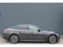 BMW i4 eDrive40 84 kWh M-Sport SOH-100% Dravitgrau Schuif-/kanteldak Leer Harman-Kardon Camera