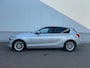 BMW 1-Serie 116i - Airco / Navi / Cruise / PDC / Leder / Elektr. ramen / Lm velgen