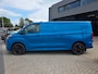 Ford E-Transit Cust. 320 L2H1 Limited 65 kWh| SoH 99%| Met o.a. 3 zits, AppleCarPlay/AndroidAuto, achteruitrijcamera en navigatie!