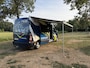 Renault Master T35 2.3 dCi 135 L3H2 Work Edition | Camper Edition | Motorsport Edition | Thule Omnistor Luifel | Airco in Leefruimte | TV | Koelkast | Magnetron | Volledig Bed | 2 Lederen Stoelen | DAB | LED Verlichting Leefruimte |
