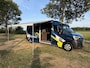 Renault Master T35 2.3 dCi 135 L3H2 Work Edition | Camper Edition | Motorsport Edition | Thule Omnistor Luifel | Airco in Leefruimte | TV | Koelkast | Magnetron | Volledig Bed | 2 Lederen Stoelen | DAB | LED Verlichting Leefruimte |