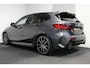 BMW 1-Serie M135i xDrive High Executive Edition / Orig. Nederlands / Panoramadak / Stoelverwarming / Apple Carplay - Android Auto / Ambienteverlichting / HUD / Achteruitrijcamera / Cruise Control / 19'' LMV / Spiegel-pakket / LED koplampen / Lederen bekleding