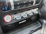 Ford Mustang Fastback 2.3 EcoBoost / 317 PK / Automaat / Race-Striping / Borla Performance sport-uitlaat / Vol-lederen stoelen mét verwarming en koeling / Keyless entry / Schakelflippers stuurwiel / Xenon lampen / Dynamische knipperlichten achter / Climate Control / Cruise Control / Bluetooth Tel + Media / Stuurwielbediening / Shaker Audiosysteem / Achteruitrij-camera + PDC achter / ETC.