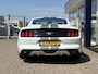 Ford Mustang Fastback 2.3 EcoBoost / 317 PK / Automaat / Race-Striping / Borla Performance sport-uitlaat / Vol-lederen stoelen mét verwarming en koeling / Keyless entry / Schakelflippers stuurwiel / Xenon lampen / Dynamische knipperlichten achter / Climate Control / Cruise Control / Bluetooth Tel + Media / Stuurwielbediening / Shaker Audiosysteem / Achteruitrij-camera + PDC achter / ETC.