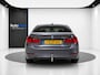 BMW 3-Serie 320i High Executive (LED, NAVI, STOELVERWARMING, CRUISE, TREKHAAK)