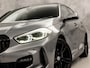 BMW 1-Serie 118i M Sport Automaat (PANORAMADAK, M PAKKET, APPLE CARPLAY, GROOT NAVI, CAMERA, SPORTSTOELEN, SPOILER, GETINT GLAS, SFEERVERLICHTING, NIEUWSTAAT)