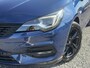 Opel Astra Sports Tourer 1.2 Ultimate 2e Eigenaar l Trekhaak l Camera l Carplay l Navi l Alcantara-Leder l 17''Lmv l Stoelverw-Stuurverw l Net beurt gehad l Dodehoek l Rijstrooksensor l Pdc V+A l 6 Bak l N.A.P l 146pk l Bj 11-2020 l Apk tot 08-2028
