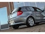 BMW 1-Serie 118i Executive | NL auto | 3e eigenaar | Achteruitrijcamera | Cruise control | Sportstuur | Climate control | Regensensor | Radio Professional | Lichtpakket | PDC | 16 inch