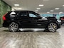 Volvo XC60 T8 AWD Recharge Polestar Long Range | Bowers & Wilkins | Trekhaak | 360° Camera | 22 Inch | 455pk | Adaptieve Cruise Control | Stoel en Stuurwielverwarming | Full LED Meesturende koplampen | Pilot Assist | Standkachel met Volvo On Call App | Elektrische voorstoelen geheugen | R-Design Contour Stoelen met wit stiksel en bies | Zitting verlenging voorstoelen | Lederen dashboard | Schuifdak | Google Infotainment | Gelamineerde/geluidwerende zijruiten | Keyless Drive | Parkeersensoren voor+achter | Geïntegreerde kinderzitjes achterin | Privacy Glass | Elektrisch bedienbare achterklep | DAB Radio | Apple Carplay/Android Auto | Draadloos telefoon opladen | Volvo On Call met mobiele App functie | Onyx Black Metallic | Unieke kenmerken: