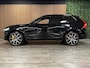 Volvo XC60 T8 AWD Recharge Polestar Long Range | Bowers & Wilkins | Trekhaak | 360° Camera | 22 Inch | 455pk | Adaptieve Cruise Control | Stoel en Stuurwielverwarming | Full LED Meesturende koplampen | Pilot Assist | Standkachel met Volvo On Call App | Elektrische voorstoelen geheugen | R-Design Contour Stoelen met wit stiksel en bies | Zitting verlenging voorstoelen | Lederen dashboard | Schuifdak | Google Infotainment | Gelamineerde/geluidwerende zijruiten | Keyless Drive | Parkeersensoren voor+achter | Geïntegreerde kinderzitjes achterin | Privacy Glass | Elektrisch bedienbare achterklep | DAB Radio | Apple Carplay/Android Auto | Draadloos telefoon opladen | Volvo On Call met mobiele App functie | Onyx Black Metallic | Unieke kenmerken: