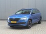 Skoda Karoq 1.5 TSI ACT 150pk DSG Sportline Business | Panorama dak | Zwenkbare trekhaak | Elektrische achterklep | Virtual Cockpit | Canton Audio