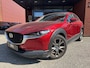Mazda CX-30 2.0 e-SkyActiv-X M Hybrid Luxury 180 PK!! // NAVI // LEDER // SCHUIFKANTELDAK // TREKHAAK // CAMERA // MEMORY SEATS // BOSE AUDIO