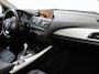BMW 1-Serie 118i Upgrade Edition | airco | bi-xenon koplampen | cruise control | lederen bekleding | navigatiesysteem full map | voorstoelen verwarmd |