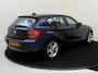 BMW 1-Serie 118i Upgrade Edition | airco | bi-xenon koplampen | cruise control | lederen bekleding | navigatiesysteem full map | voorstoelen verwarmd |
