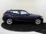 BMW 1-Serie 118i Upgrade Edition | airco | bi-xenon koplampen | cruise control | lederen bekleding | navigatiesysteem full map | voorstoelen verwarmd |