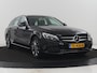 Mercedes-Benz C-klasse Estate 180 Business Solution | Half leder | Stoelverwarming | Navigatie | Bluetooth | Camera | Park assist | Cruise control | Climate control | Elektrische achterklep | Trekhaak