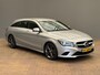 Mercedes-Benz CLA Shooting Brake 180 OrangeArt Edition Leder/Stof Sportstoelen | Stoelverwarming | Parkeersensoren Rondom | Airco | Cruise | 17" Lichtmetaal | 360° Parkeersensoren | AMG-styling | Airco