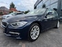 BMW 3-Serie 320i High Executive | Leer | Open dak
