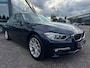 BMW 3-Serie 320i High Executive | Leer | Open dak