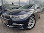 BMW 3-Serie 320i High Executive | Leer | Open dak