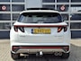 Hyundai Tucson 1.6 T-GDI HEV N Line Sky | Navigatie/Android/Apple Carplay | LMV 19" | Elektrisch Glazen Panoramadak | Adaptieve Cruise Control | Voorstoelen/Achterbank Verwarmd | Rondomzichtcamera | Airco Automatisch |