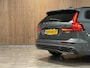 Volvo V60 T6 AWD Recharge Ultra Dark | Trekhaak | 360 Camera | Schuifdak | Head-Up Display | Harman Kardon | Adaptieve Cruise Control | Stoelverwarming voor+achter | Stuurwielverwarming | Full LED Meesturende koplampen | Pilot Assist | BLIS Dode Hoek Detectie | Elektrische voorstoelen geheugen | Lederen bekleding | Zitting verlenging voorstoelen | Lederen dashboard | Google Infotainment | Keyless Drive | Parkeersensoren voor+achter | Privacy Glass | Elektrisch bedienbare achterklep | DAB Radio | Apple Carplay/Android Auto | Volvo On Call met mobiele App functie | Forest Lake Metallic |