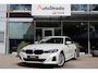BMW 3-Serie (g20) 320e High Executive 204pk | SoH 97% | Curved Display I Leder | Camera I Climate I Carplay I DAB I