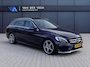Mercedes-Benz C-klasse Estate 180 Business Solution AMG | Incl. 12 maanden garantie | Lederen sportstoelen | Cruise control | Climate control | Trekhaak | Zwarte hemel | LED Koplampen | 18" LM | Elektrische achterklep | Achteruitrijcamera | Dodehoek detectie |