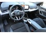 BMW X1 sDrive18i M-Sport | Panorama dak | Elektrisch wegklapbare trekhaak | Stoelverwarming | Achteruitrijcamera | Elektrische kofferbakklep | Keyless entry/start | Half leder/alcantara | Draadloze telefoonlader | Apple CarPlay/Android Auto | Navigatie | Climate controle | Parkeersensoren V+A |