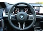 BMW X1 sDrive18i M-Sport | Panorama dak | Elektrisch wegklapbare trekhaak | Stoelverwarming | Achteruitrijcamera | Elektrische kofferbakklep | Keyless entry/start | Half leder/alcantara | Draadloze telefoonlader | Apple CarPlay/Android Auto | Navigatie | Climate controle | Parkeersensoren V+A |
