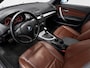 BMW 1-Serie 120i High Executive (LEDER, CRUISE, TREKHAAK, STOELVERWARMING)