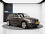 BMW 1-Serie 120i High Executive (LEDER, CRUISE, TREKHAAK, STOELVERWARMING)