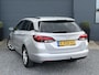Opel Astra Sports Tourer 1.2 Business Executive ✓1e Eigenaar✓146pk✓Camera✓Trekhaak✓Carplay✓Airco✓Cruise✓Pdc V+A✓Lm velgen✓Comfortstoelen✓6 Bak✓N.A.P✓Nieuwe Apk bij Aflevering