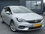 Opel Astra Sports Tourer 1.2 Business Executive ✓1e Eigenaar✓146pk✓Camera✓Trekhaak✓Carplay✓Airco✓Cruise✓Pdc V+A✓Lm velgen✓Comfortstoelen✓6 Bak✓N.A.P✓Nieuwe Apk bij Aflevering