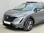 Nissan Ariya e-4ORCE Evolve 91 kWh / 4WD / Leder / Head- Up Display / Warmtepomp / 10 Jaar Nissan More Garantie / Stoelverwarming voor en achter / Schuif-Kantel Dak / Stoelventilatie / Stuurverwarming / Rondomzicht camera / Elektrisch Verstelbare Stoelen met Geheugen / Elektrische Achterklep / Adaptief Cruise Control / Apple Carplay & Android Auto /