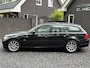 BMW 3-Serie Touring 320i High Executive Panoramadaken LEER Navigatie Cruise Control Climate Control