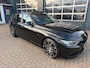 BMW 3-Serie Touring 320i High Executive M-Sport / Pano / Carplay / Leder / Trekhaak .