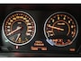 BMW 1-Serie 118i High Executive (CAMERA, STOELVERWARMING, NAVIGATIE, CRUISE CONTROL)