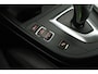 BMW 1-Serie 118i High Executive (CAMERA, STOELVERWARMING, NAVIGATIE, CRUISE CONTROL)