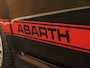 Fiat 500 1.4 T-Jet Abarth Turismo - VERKEERT IN EEN ZEER NETTE STAAT - 17 INCH LICHT METALEN VELGEN - SPORTSOELEN - LEDEREN BEKLEDING - STOELVERWARMING - SCHAKELFLIPPERS ACHTER HET STUUR - DUBBELE UITLAAT - 4 SEIZOENENBANDEN - PARKEERSSENSOREN ACHTER - CRUISE CONTROL - 160 PK - PANORAMADAK - PORTABLE TOM TOM NAVIGATIE
