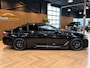 BMW 5-Serie M550i xDrive High Executive Bom vol | leder | beeldschermen achterin | en een adembenemend geluid